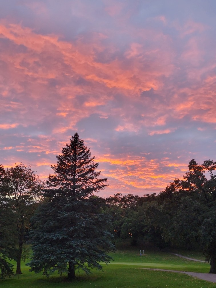 golf course with pink clouds